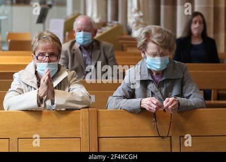 File photo dated 15/07/20 of members of the congregation during the first mass held at St Andrew's Cathedral in Glasgow since the 19th March 2020 as Scotland prepared for the lifting of further coronavirus lockdown restrictions. Tuesday marks the first anniversary of the announcement on March 23, 2020 of the first UK-wide lockdown. Issue date: Monday March 22, 2021. Stock Photo