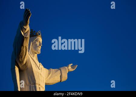 The world's tallest statue of Jesus Christ, Swiebodzin, Poland. Deep blue skies in the background. Made in the late afternoon on a sunny day. Stock Photo