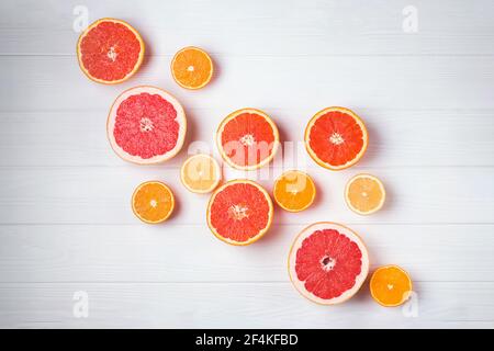Flat lay composition with halves of different citrus fruits Stock Photo