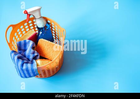 Colorful composition with a set of bright cleaning sponges and cleaning agent. Cleaning service concept. Stock Photo
