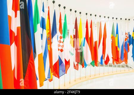 Brussels, Belgium. Row of flags of participating member nations inside the European Parliament.
