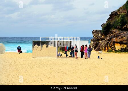 Sydney, NSW, Australia - October 31,2017: Unidentified people on beach of Tamarama by outdoor exhibition Sculpture by the Sea, artwork Temple from Iso Stock Photo