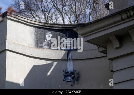 A black-and-white stencilled image of a typewriter which has appeared on the wall of a Bridge in Reading, Berkshire, similar to the Banksy mural which appeared on Reading Prison earlier this month. The image of a boy with the words, Cherish, Love and Hope appeared in addition after a Team Robbo tag was added over the weekend. Picture date: Monday March 22, 2021. Stock Photo