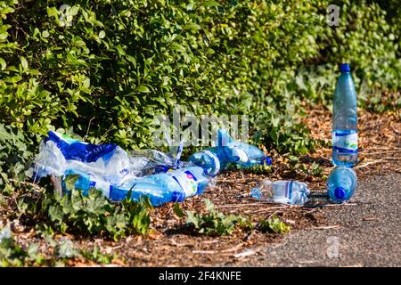 Empty plastic PET bottles of mineral water left behind by firefighters after having put out fire, Hungary, Europe Stock Photo