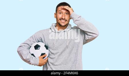 Handsome Man With Tattoos Holding Soccer Ball Pointing Finger To One Self Smiling Happy And Proud Stock Photo Alamy