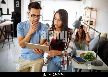 Group of young business people and designers working on project. Startup concept. Stock Photo