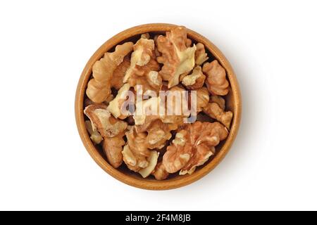 Walnuts in wooden bowl on white background Stock Photo