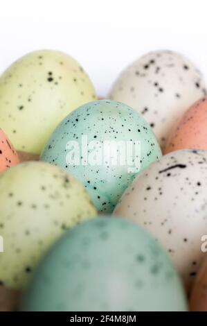 Speckled Pastel Eggs on White Background Stock Photo