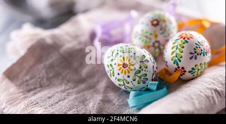 Handmade colorful easter eggs on a linen napkin. Stock Photo