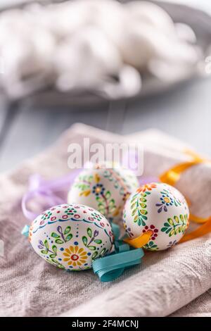 Handmade colorful easter eggs on a linen napkin. Stock Photo