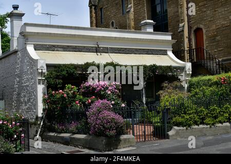 Melbourne, VIC, Australia - November 05, 2017: Home in Victorian style with flower beds in East Melbourne Stock Photo