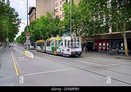 Melbourne, VIC, Australia - November 05, 2017: Unidentified people, shops and public tramway in Swanston Street Stock Photo