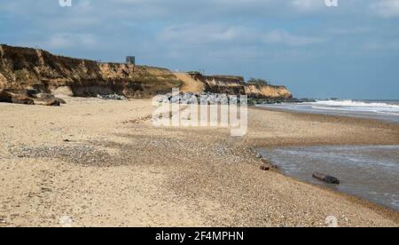 A view of Happisburgh sea defence and sandy beach Stock Photo