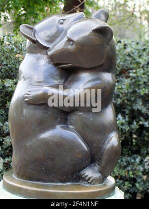 small bronze statue of two small bears hugging or playing Stock Photo