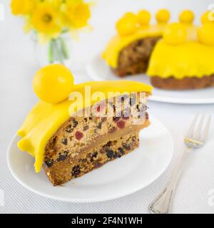 Simnel cake - English Easter cake with dried fruits and marzipan. Stock Photo