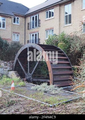 Milton Regis, Kent, UK. 22nd March 2021. Swale Council have announced in partnership with Sittingbourne Society & East Kent Engineering Partnership to enhance the site of an ancient watermill situated within the residential area of Periwinkle Close, Milton Regis. Swale have purchased the area surrounding the mill wheel which dates back to Roman times. Archaeological investigations in the 1960’s found Roman Samian pottery shards on the site, suggesting it’s use as a mill spanned two millennia. The site pictured today, work is expected to start in June. Credit: James Bell/Alamy Live News Stock Photo