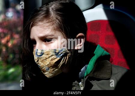 12 year-old boy looking out of the bus window, Barcelona Spain. Stock Photo