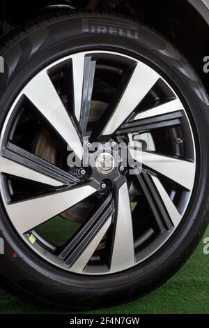 Russia, Izhevsk - February 19, 2021: Nissan showroom. The wheel with alloy wheel of a new Murano car. Famous world brand. Stock Photo