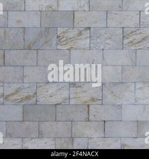 Seamless texture of marble tiles on the wall. Background White-gray with brown streaks. Stock Photo