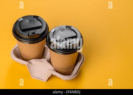 Disposable dishes made of environmentally friendly brown cardboard recycled from paper waste Stock Photo