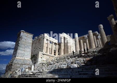 Athens, Greece. 22nd Mar., 2021. The Propylaea, the gateway of Acropolis Hill is seen during the first day of the reopening of the archaeological sites, in Athens, Greece. ©Elias Verdi/Alamy Live News Stock Photo