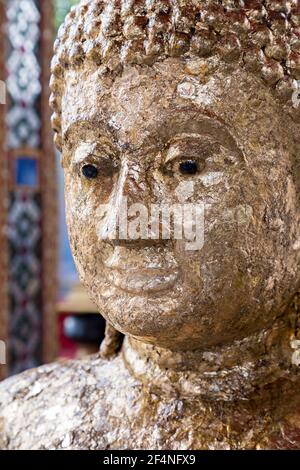 Face covered in gold leaf, Luang Poh Dang at Wat Prok Charoen, Bangkok, Thailand Stock Photo