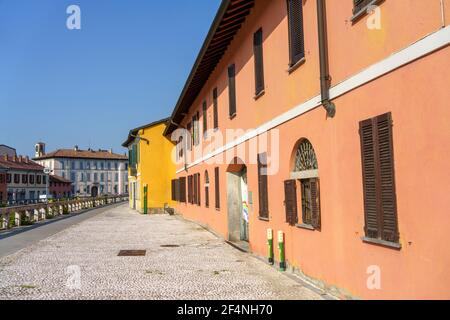 Gaggiano (Milan, Lombardy, Italy), historic town with colorful buildings along the Naviglio Grande, at summer Stock Photo