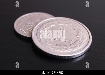 Polish coins 1 zloty on a black background close up Stock Photo