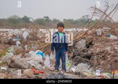 Chaco Province. Argentine. Indigenous boy is collecting plastic