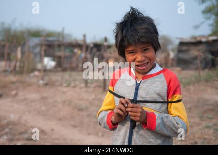Chaco Province. Argentine. 15-01-2019. Portrait of an indigenous boy at his village in the Chaco Province, North of Argentine. Stock Photo