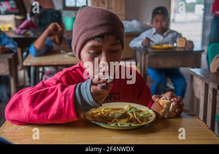 Chaco Province. Argentine. 15-01-2019. Portrait of an indigenous boy having lunch while attending school in the Chaco Province, North of Argentine. Stock Photo