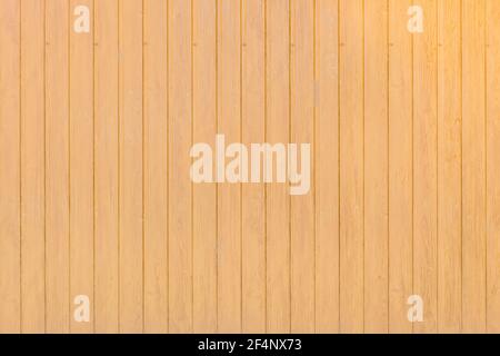 Light yellow coating imitating the wooden fence wall texture of the background. Stock Photo