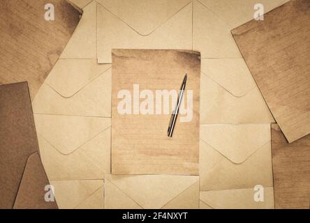 Vintage old brown envelope and paper background texture top view, Flat lay copy space, business, education, antique, rustic concept Stock Photo