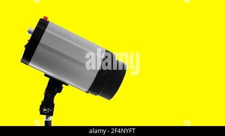 Studio strobe flash on the yellow Stock Photo