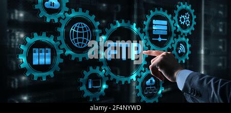 Businessman Hand touching FTP inscription. Mixed Media Technology concept. Stock Photo