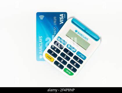 Barclays Pinsentry card reader device and a Visa Debit card on white Stock Photo
