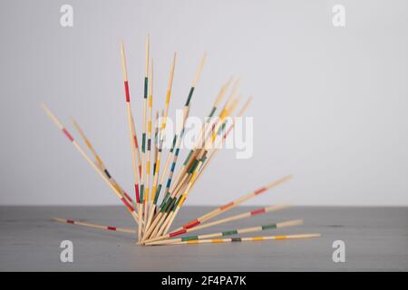 mikado game sticks, fallen down on a wooden board, motion blur Stock Photo