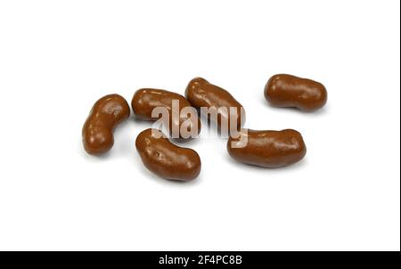 Chocolate, sweet crunchy snack isolated on white background. Chocolate balls on white background. chocolate covered corn flips. Stock Photo