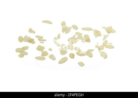 Blanched almonds flakes. Pile of peeled flaked almonds isolated on white. Stock Photo