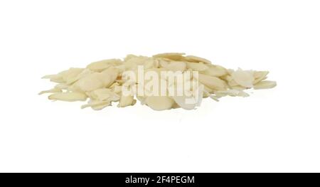 Blanched almonds flakes. Pile of peeled flaked almonds isolated on white. Stock Photo