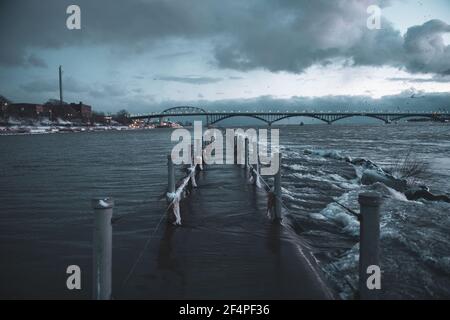 Flood Water Spills Over Break Wall Walkway Stock Photo