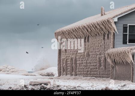 House Encased in Ice in Lake Erie Storm Stock Photo