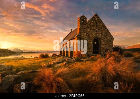 Church of The Good Shepherd at sunset. This iconic church is located on the shore of Lake Tekapo, the South Island of New Zealand. Stock Photo