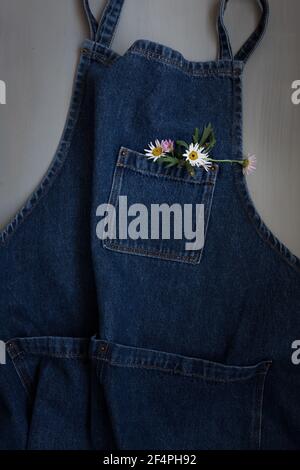 Denim apron isolated on gray background. Stock Photo