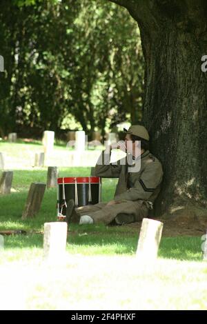 The Old City Cemetery, Lynchburg, VA, USA. Civil War reenactor in the Confederate Cemetery. Stock Photo