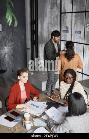 High angle view at diverse group of business people working in office Stock Photo