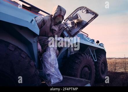 Russian Solider exits an armored personnel carrier, BTR, during a weeklong military training in Nuclear, Chemical and Biological warfare in the Russian far North. 1995 Stock Photo