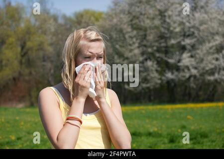Woman does outdoor stretching with her personal trainer on a great summer day Stock Photo