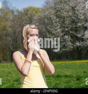 Woman does outdoor stretching with her personal trainer on a great summer day Stock Photo