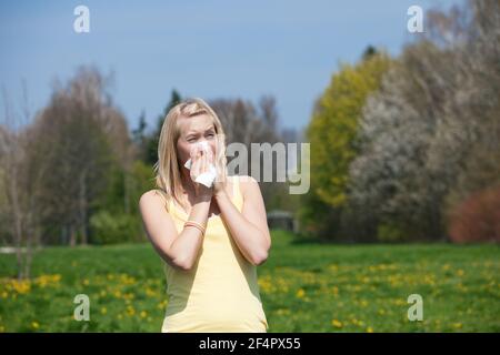 Woman does outdoor stretching with her personal trainer on a great summer day Stock Photo